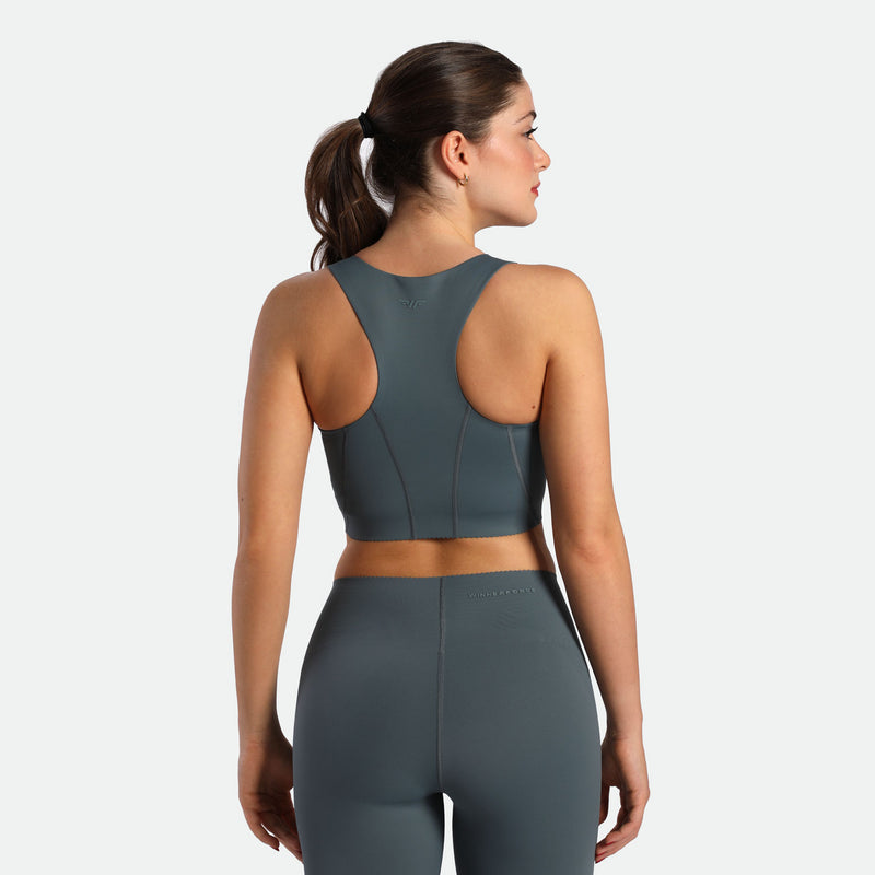 a back view for fit woman wearing matching set stormy grey  bra and legging 