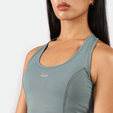 close up view for fit woman wearing dress green with logo 