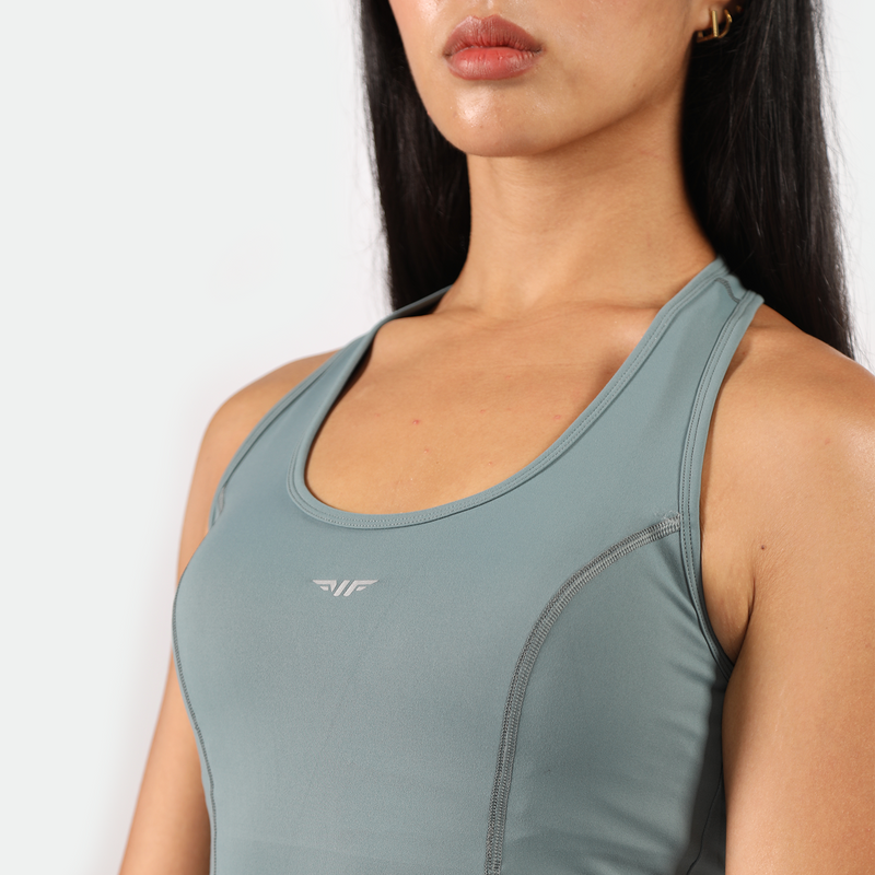 close up view for fit woman wearing dress green with logo 