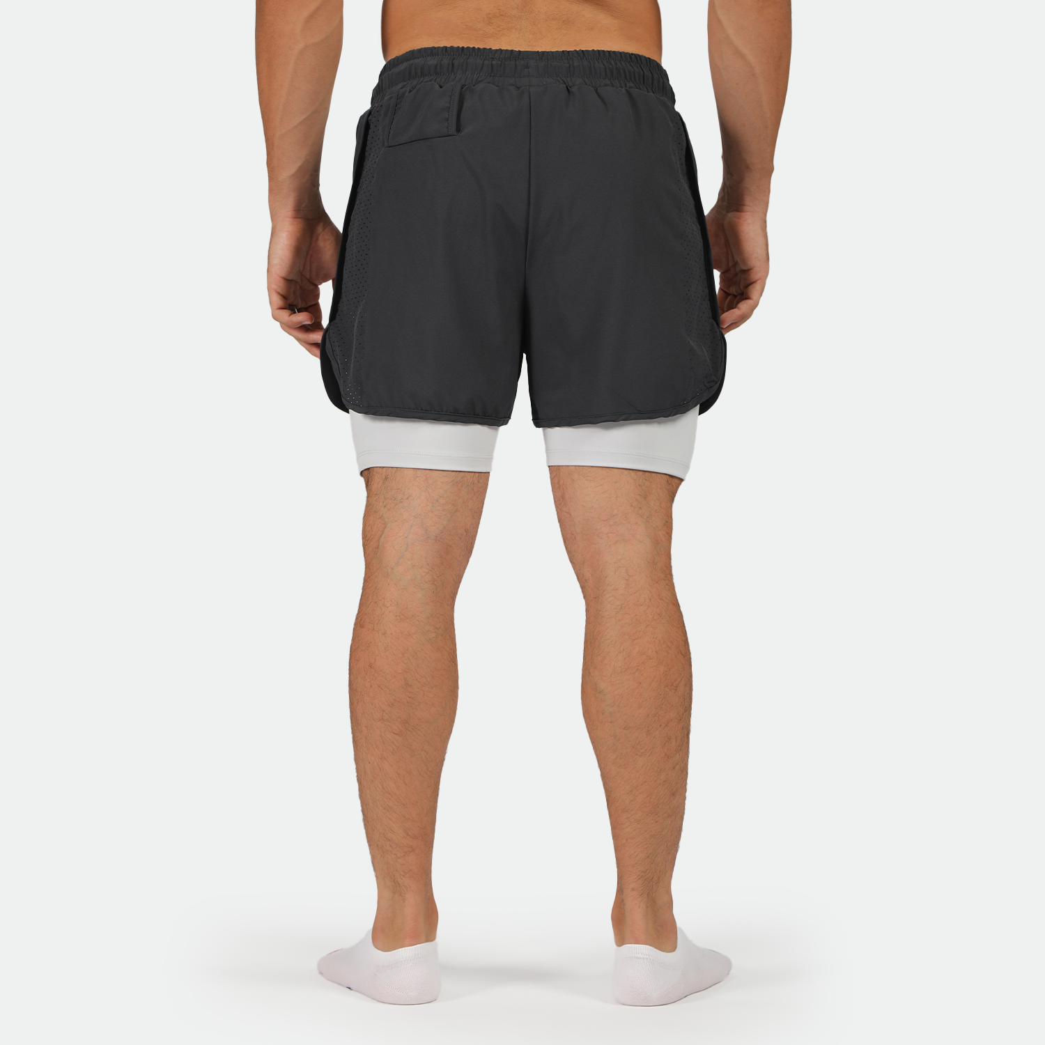 a back view for man wearing short 2 in 1 with socks 