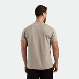 a back view for fit man wearing t-shirt AGATE-GREY with pants black 