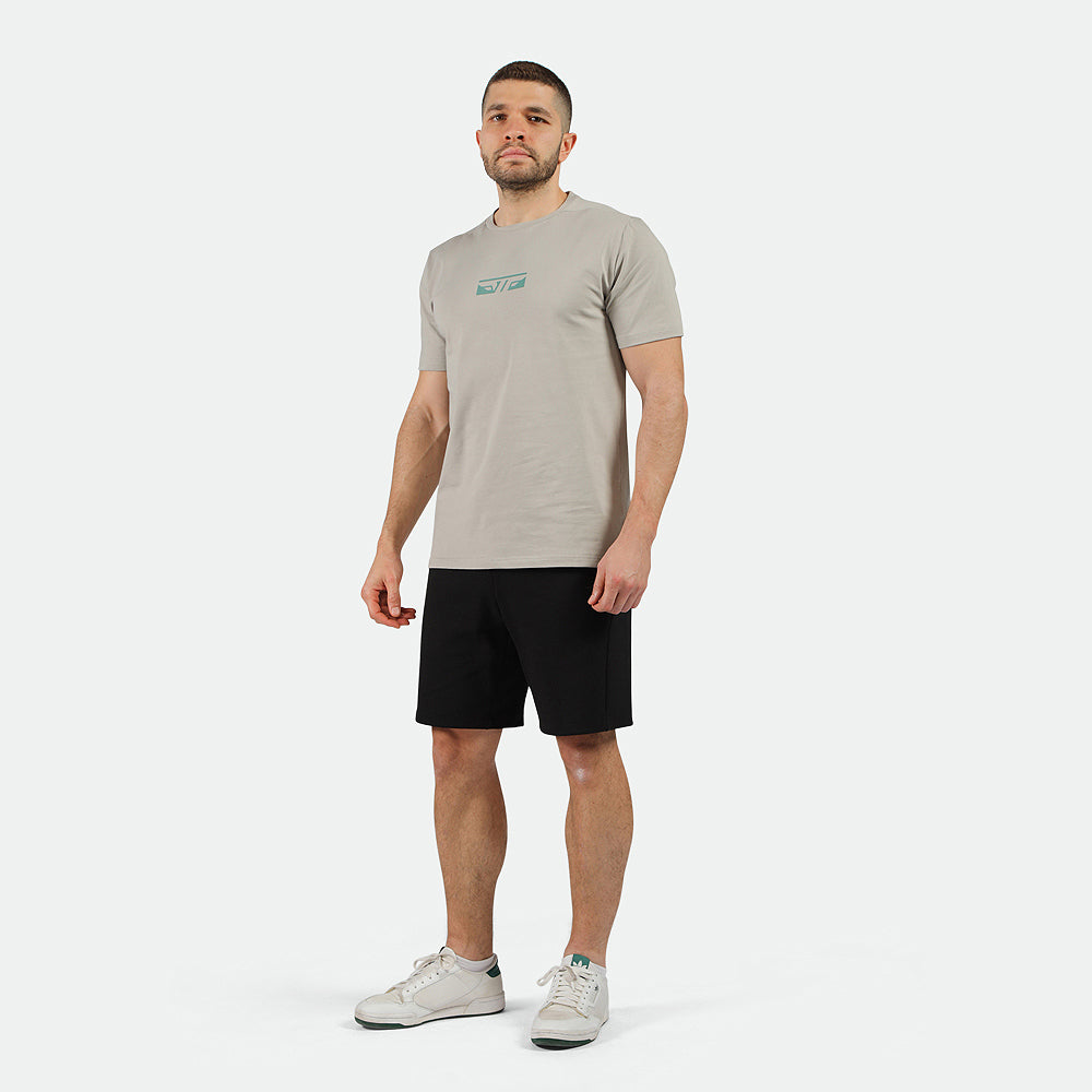 a fit man wearing t-shirt grey with short black ,plus the shoes white 