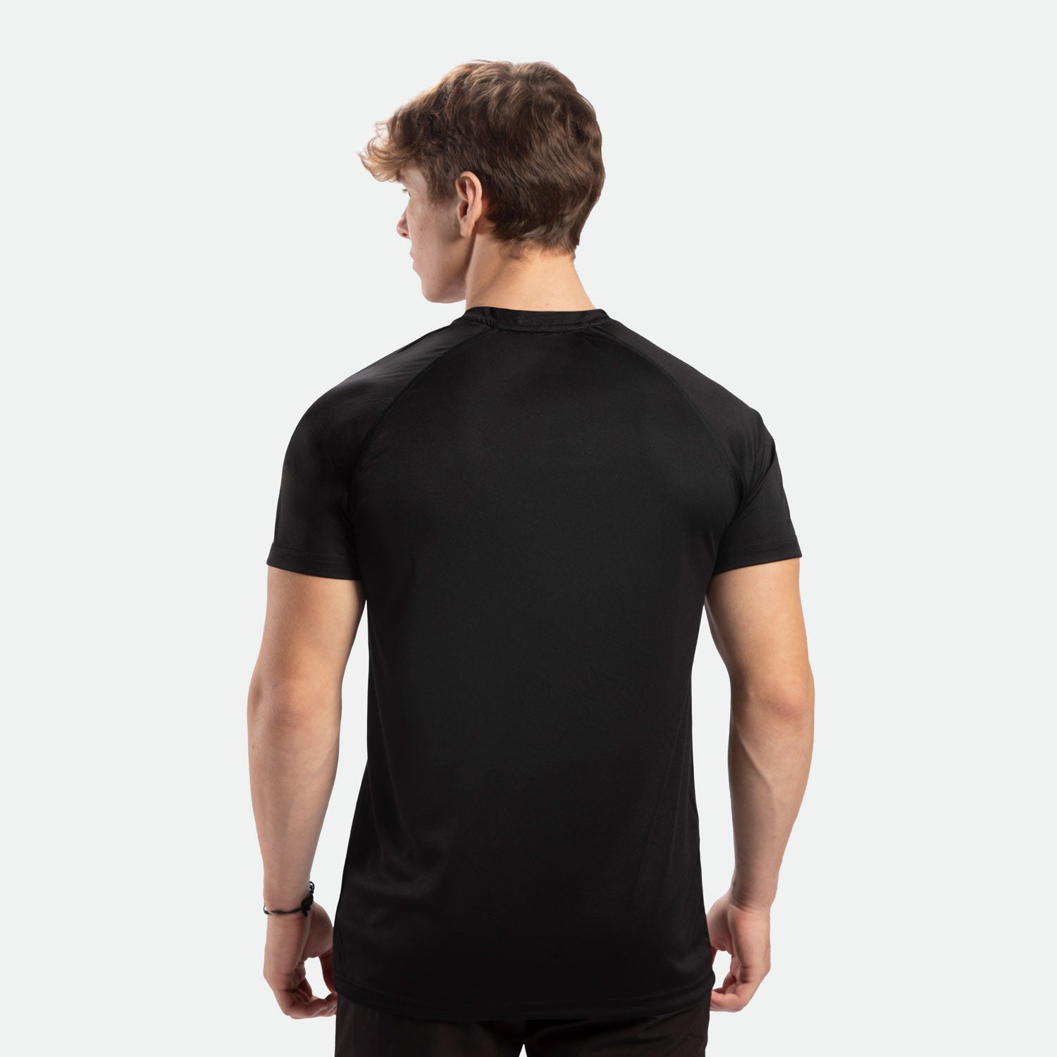 a back view for men wearing t-shirt black with pants black 