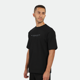 a fit man wearing matching color set black ,t-shirt and short 