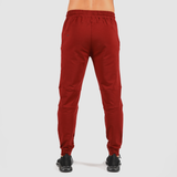 a back view for fit man wearing pants dark red with shoes black 