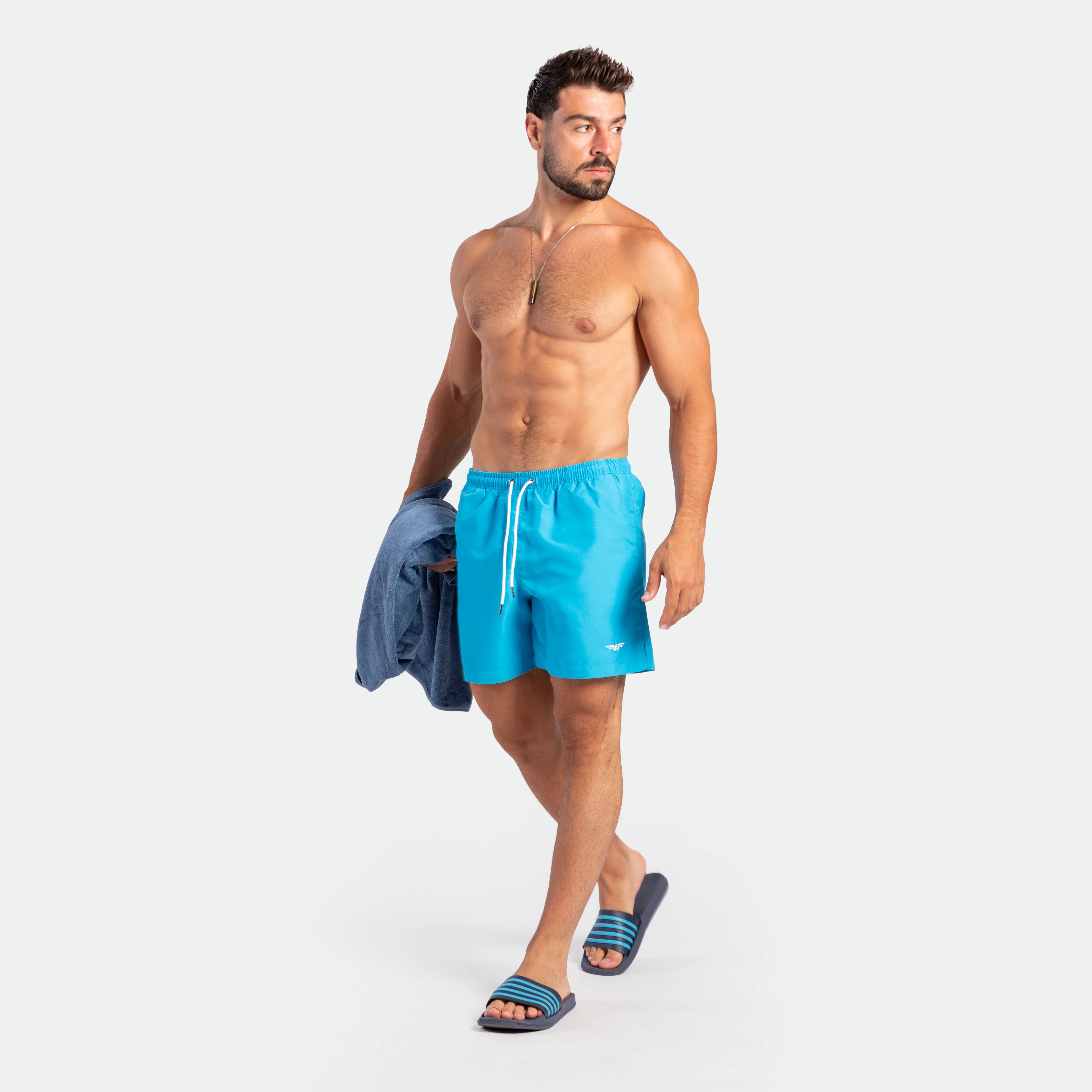 a fit man stand at right and wearing short DEEP SKY BLUE
