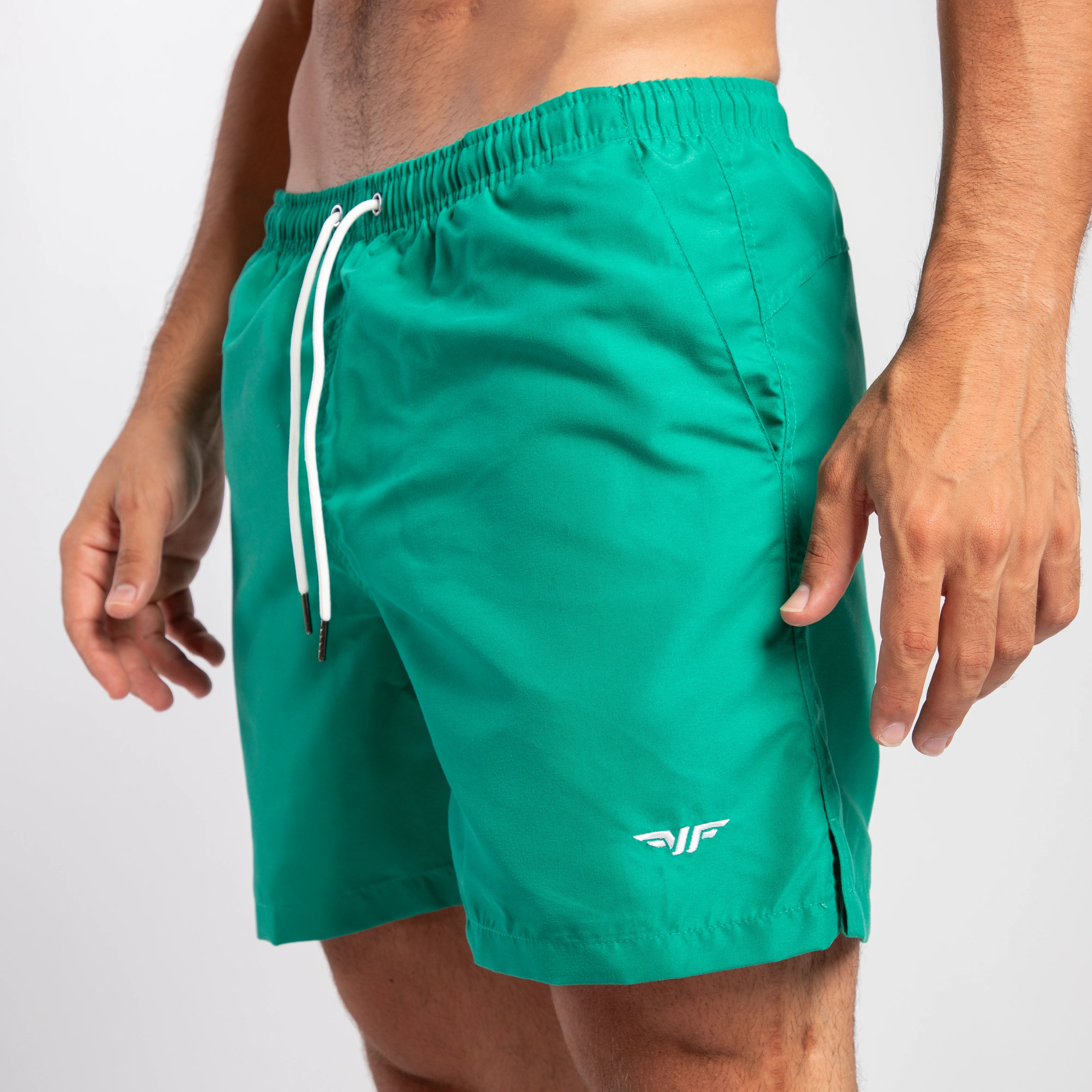 close up view for fit man wearing short green lake 