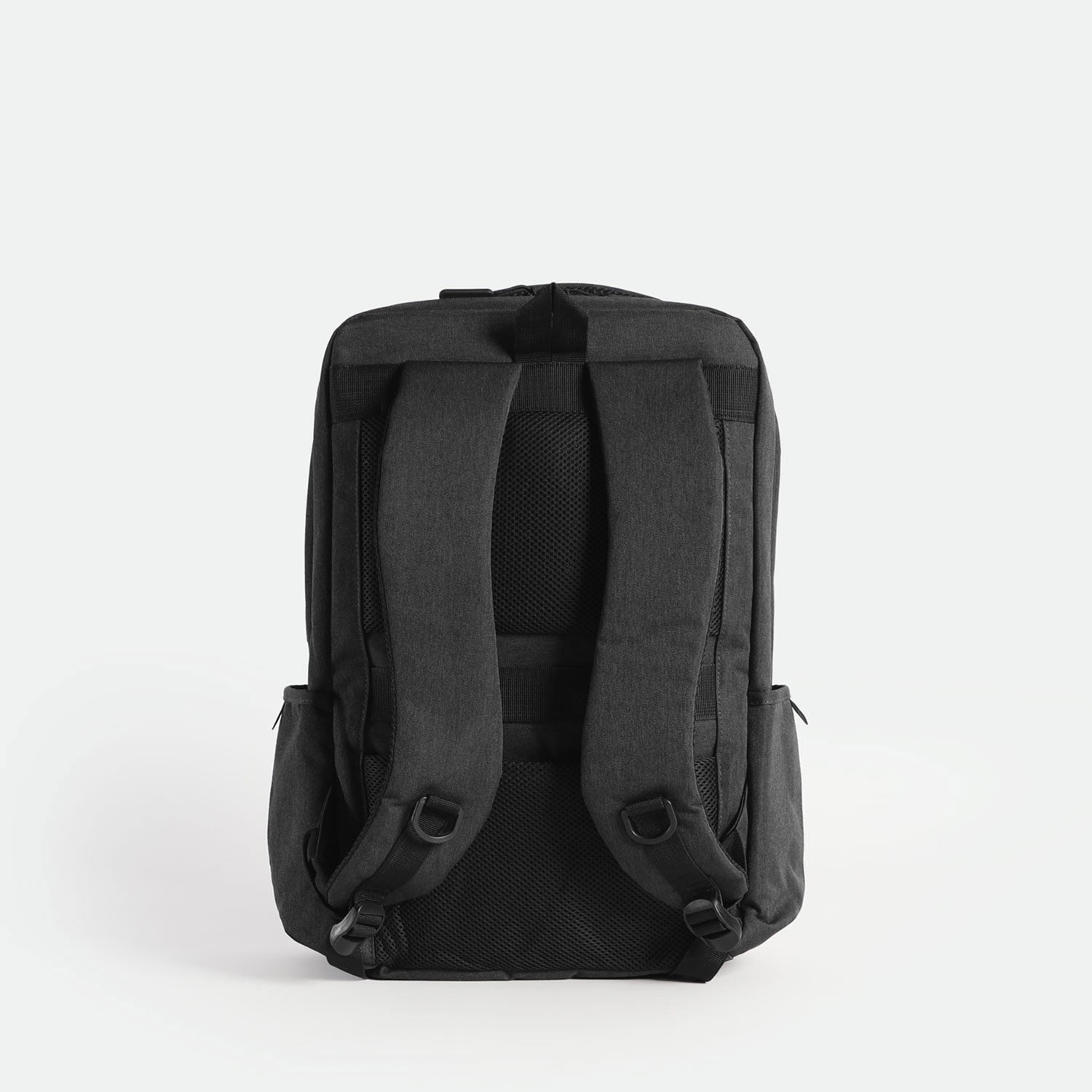 Back view of a  iron grey backpack featuring two adjustable padded shoulder straps, a padded back panel with breathable mesh, and a sturdy top handle