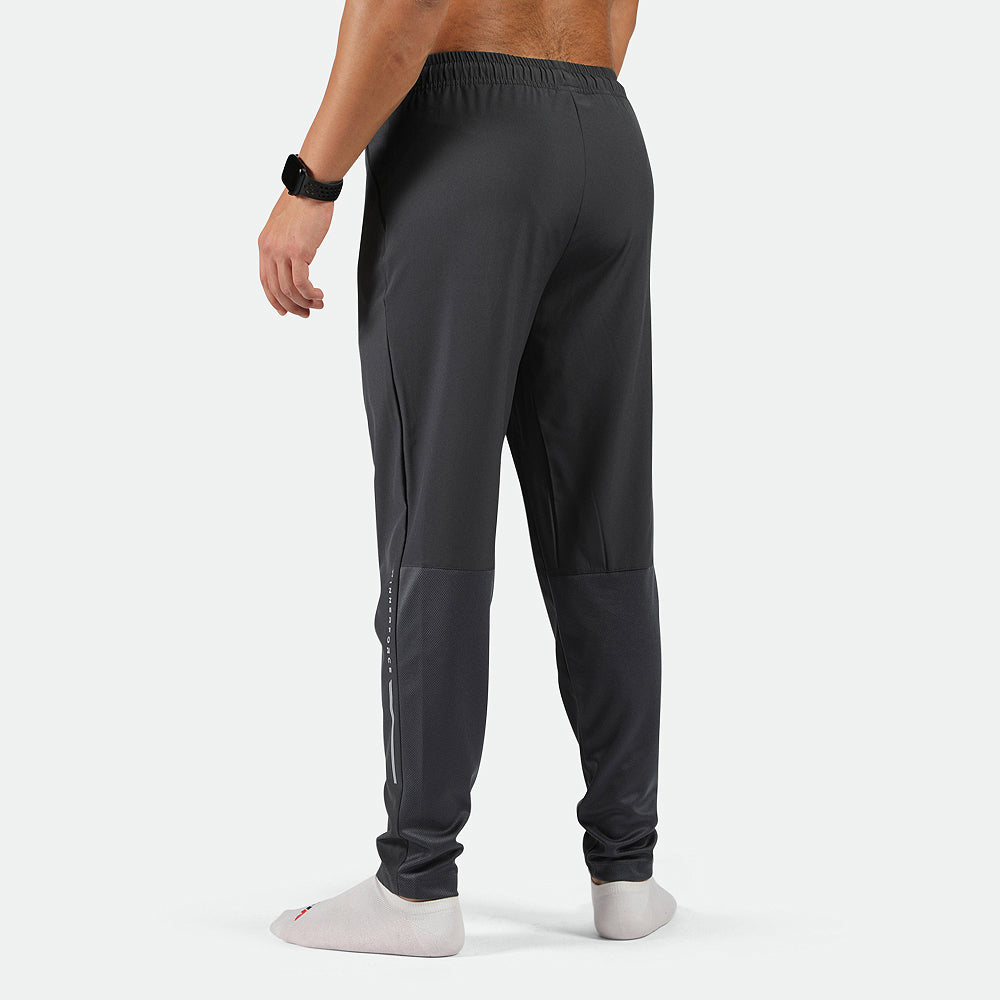 a back view for fit man wearing phantom grey pants with socks white 