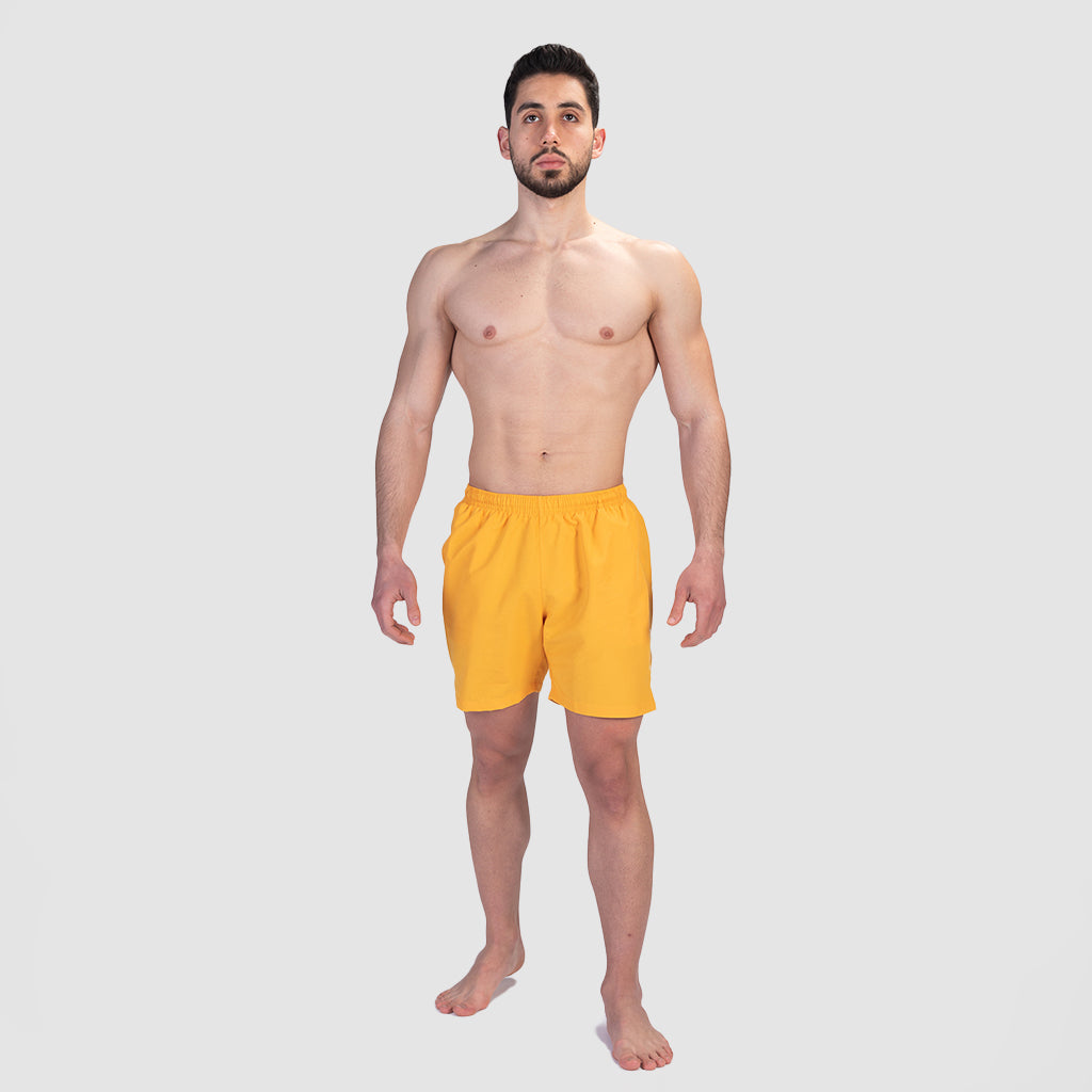 a fit man wearing short canary yellow 