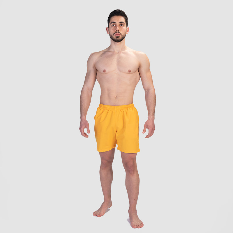a fit man wearing short canary yellow 