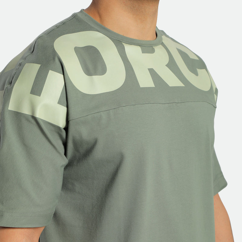 close up view for fit man wearing t-shirt agave green with logo 
