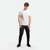 a fit man wearing camo  t-shirt white with pants and shoes black 