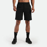 a fit man wearing short black with lace and logo ,plus the socks and shoes black 