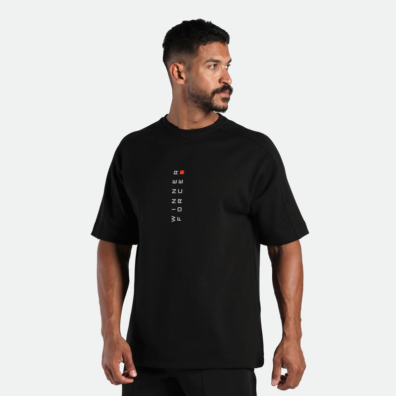 close up view for fit man look at right and wearing t-shirt back with logo 