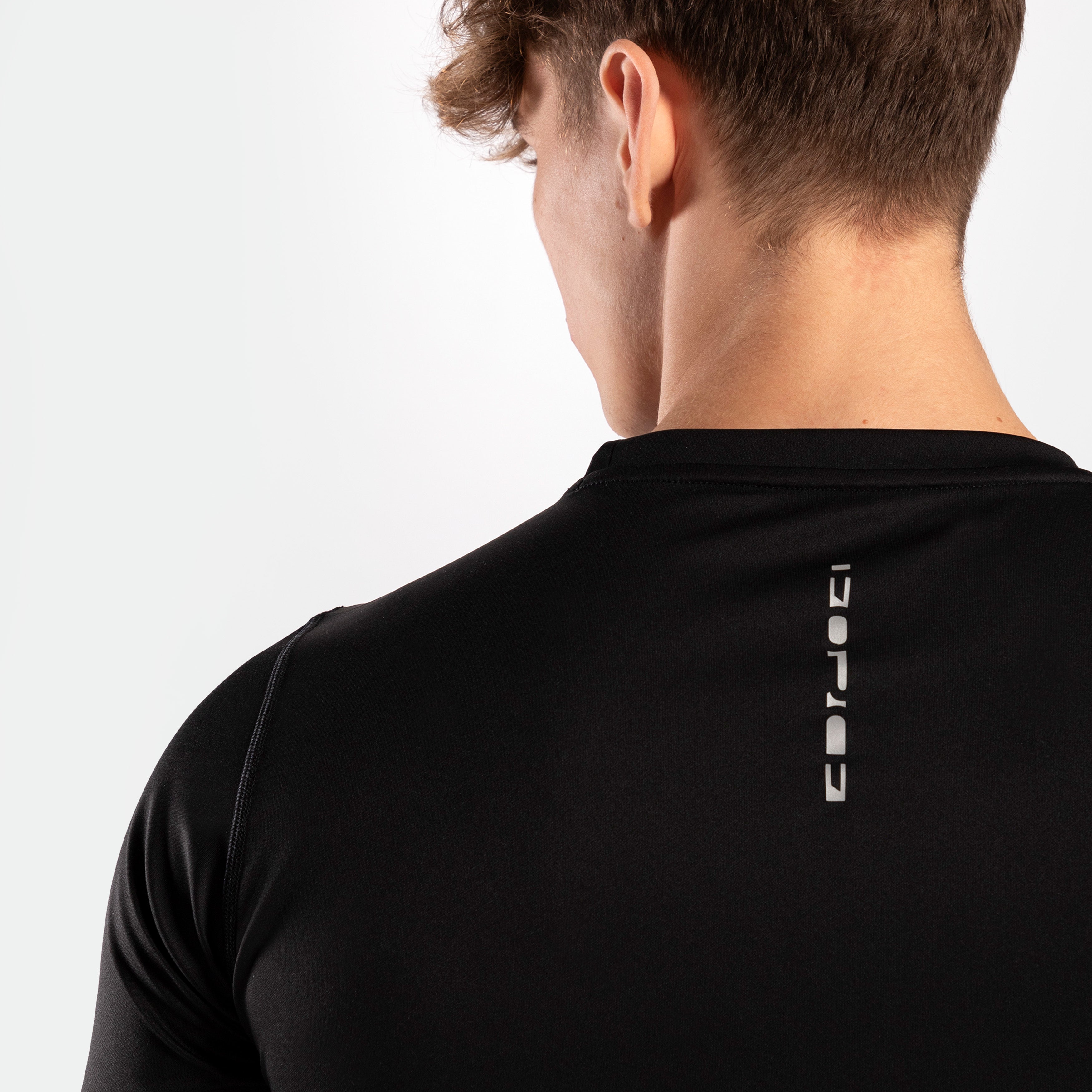A close-up of the word FORCE written on a t-shirt of color black.