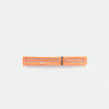 A coral  rose , rectangular zippered pouch with two parallel reflective strips and zipper pulls, displayed against a plain white background