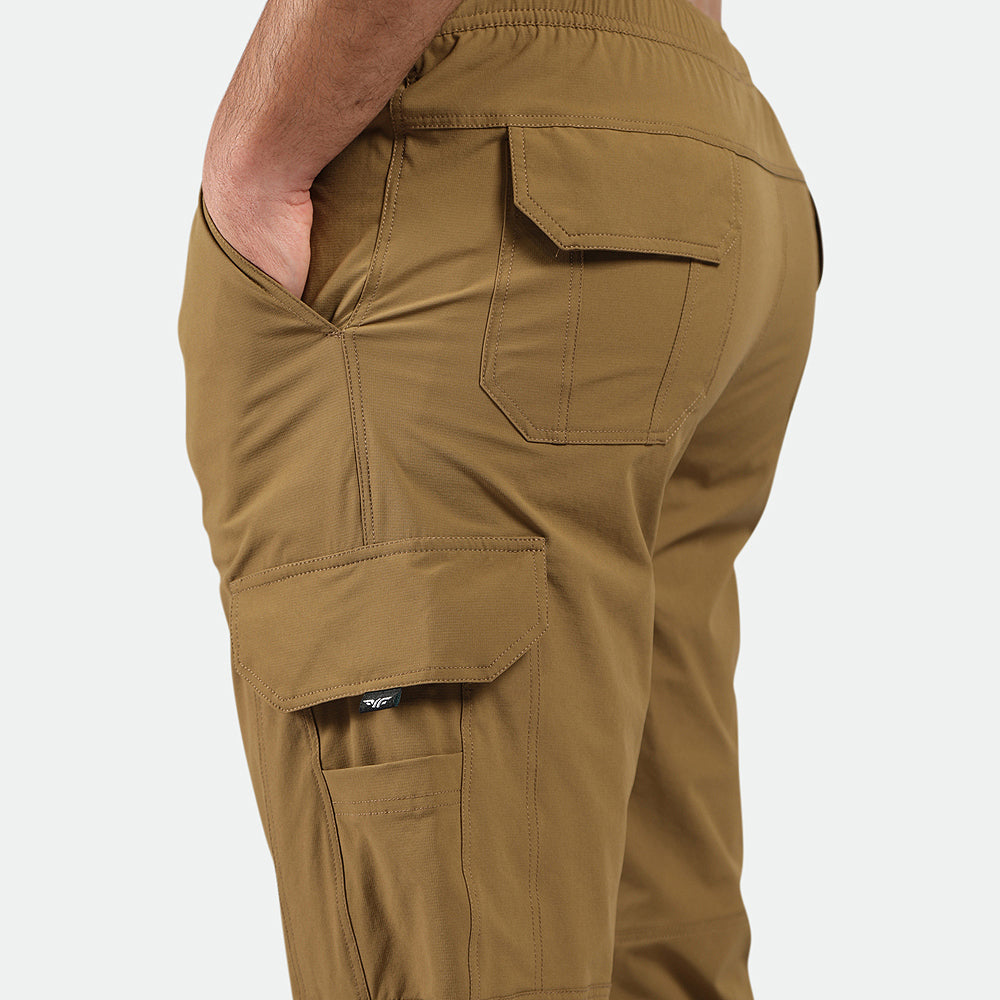 close up view for fit man wearing Breen brown pants 
