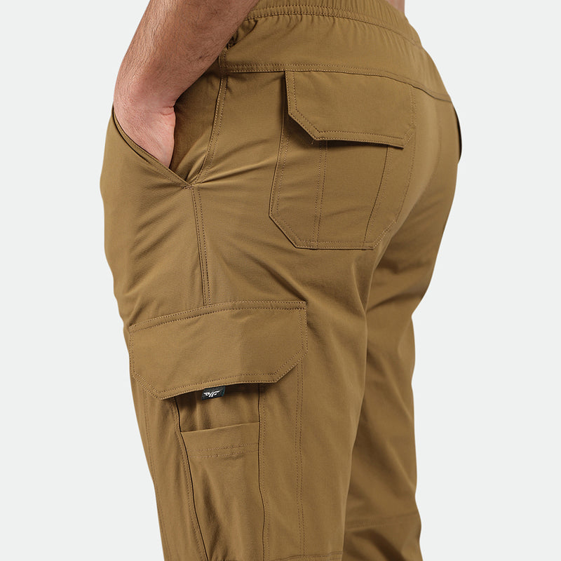 close up view for fit man wearing Breen brown pants 