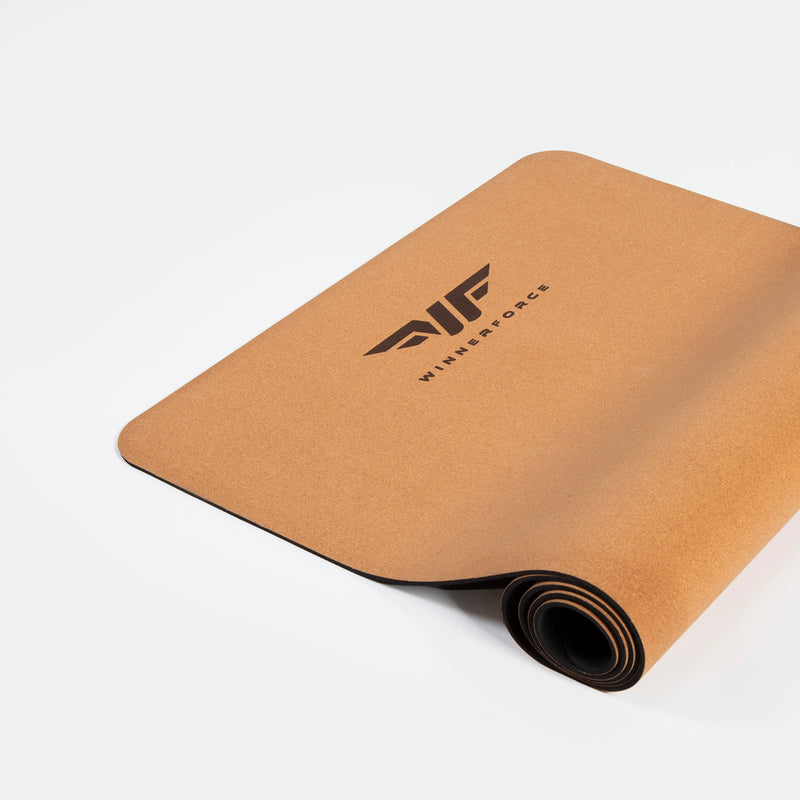 A fitness mat partially unrolled, showcasing a TOBACCO-BROWN surface with a black logo and "WINNERFORCE" 