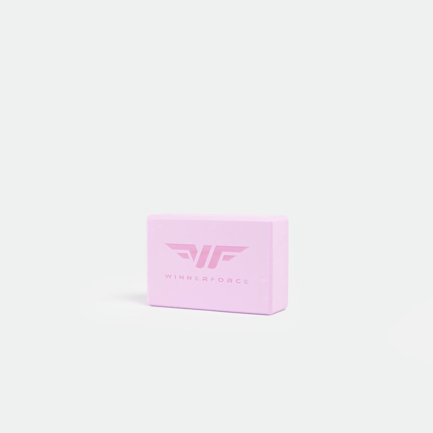 Pink fitness block with "WINNERFORCE" and logo in the center, set against a plain white background. Simple, modern design implying strength and balance.