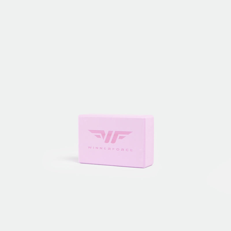 Pink fitness block with "WINNERFORCE" and logo in the center, set against a plain white background. Simple, modern design implying strength and balance.
