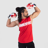 a fit man wearing high risk red with logo and pants black 