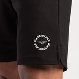 close up view for fit man wearing short  black with logo 