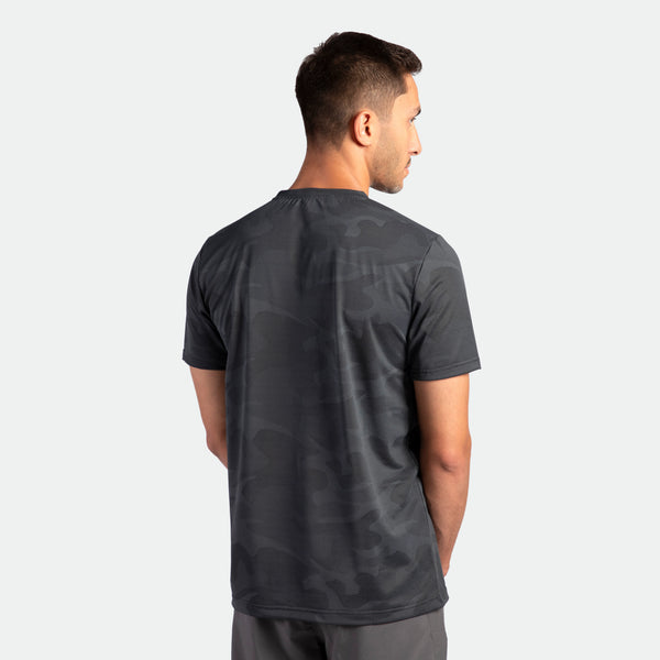a back view for fit man wearing t-shirt camo graphite blue with pants grey 