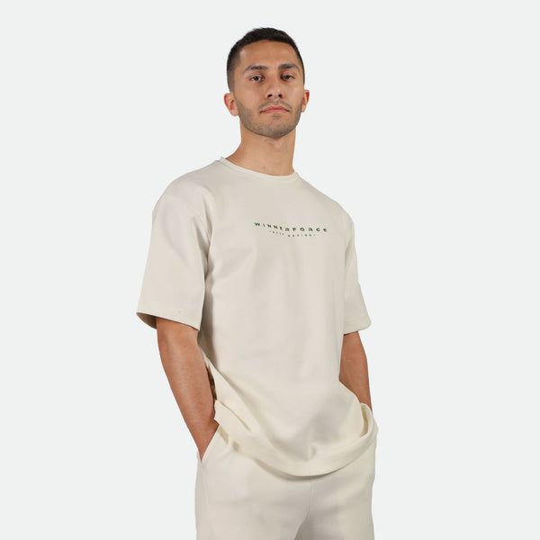 a fit man wearing matching set light beige ,t-shirt and short 