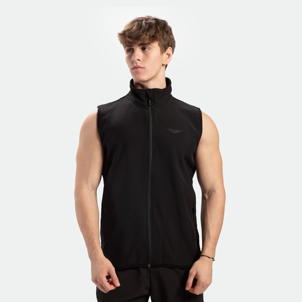 a fit man wearing zip vest black with pants black 