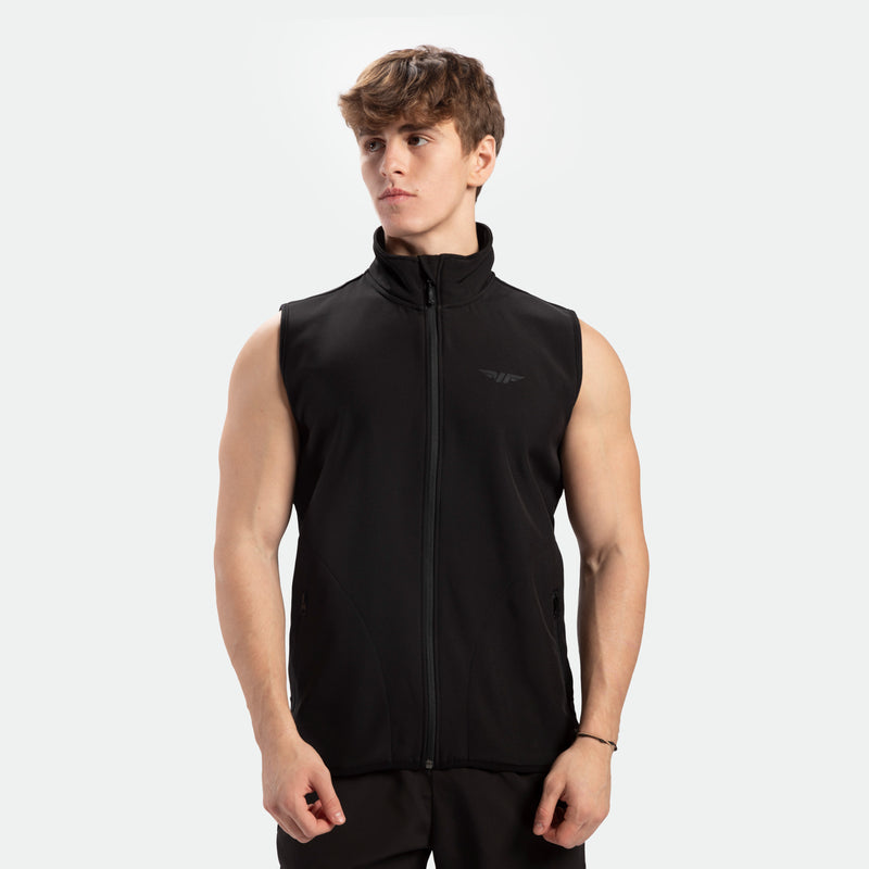 a fit man wearing zip vest black with pants black 