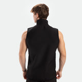 a back view for fit man wearing zip vest  black with pants black 