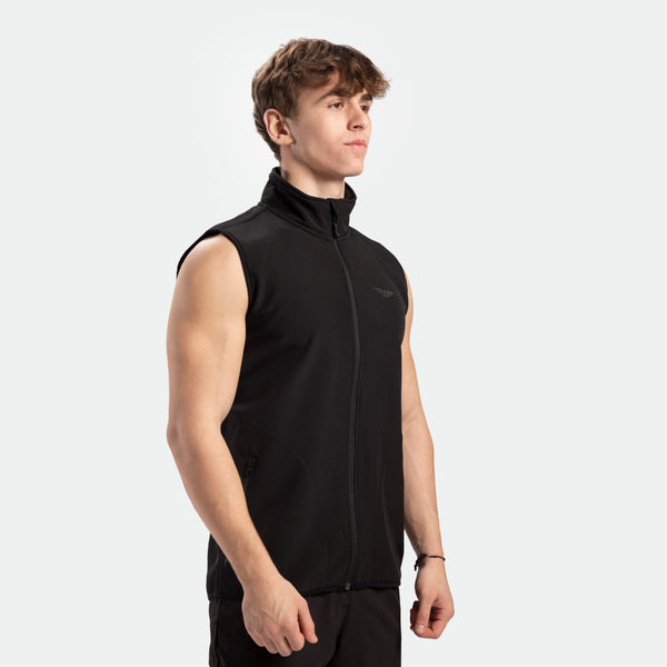 a fit man wearing zip vest black with pants black 