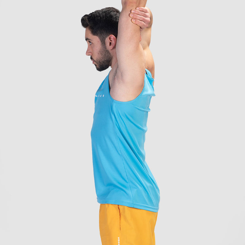 a fit man stand at right  and wearing  tank royal blue with short yellow 
