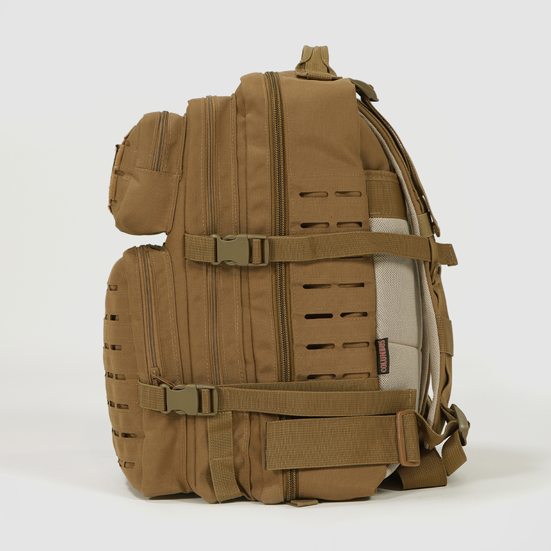 A tan tactical backpack with multiple zippered compartments, adjustable straps, side buckles, and MOLLE webbing, shown standing upright against a plain white background