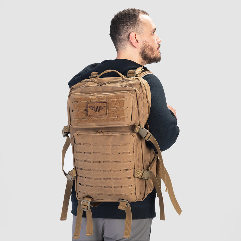 a back view for fit man wearing backpack coyote 