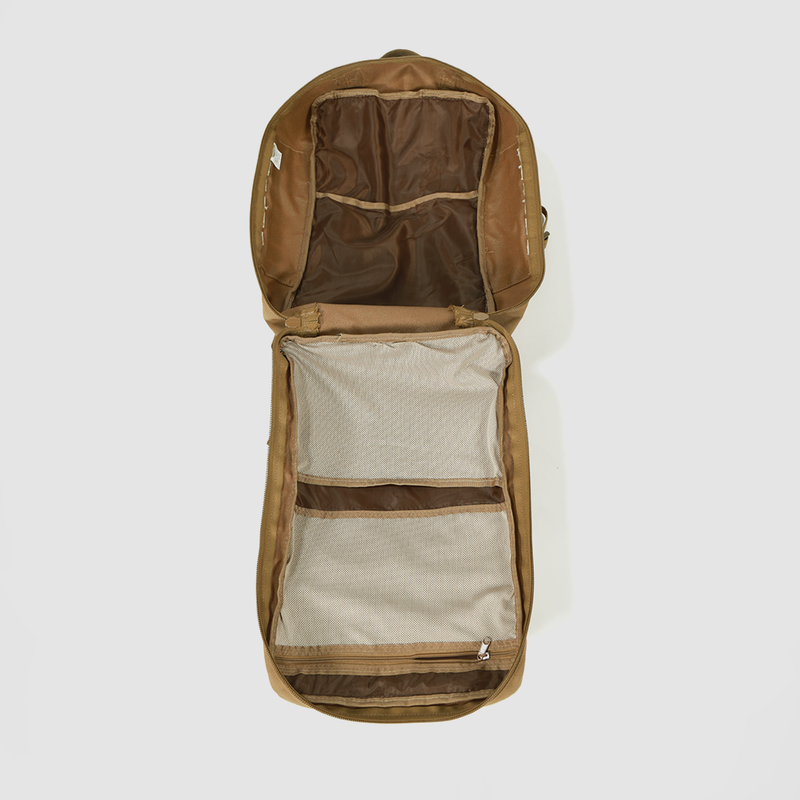 An open brown backpack lies flat on a white surface, showing its spacious interior with mesh zippered compartments and additional storage pockets inside the li