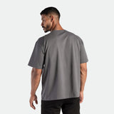 a back view for fit man wearing t-shirt magnet dark grey  with short  black  