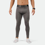 a fit man wearing legging Quiest shade grey with socks white 