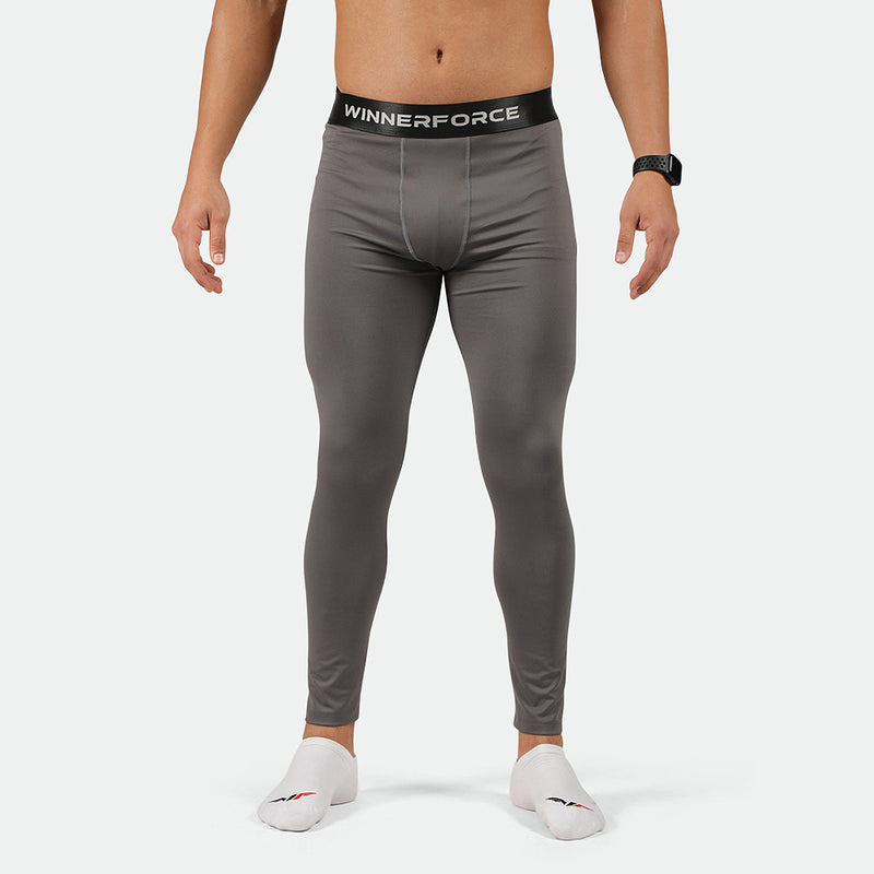 a fit man wearing legging Quiest shade grey with socks white 