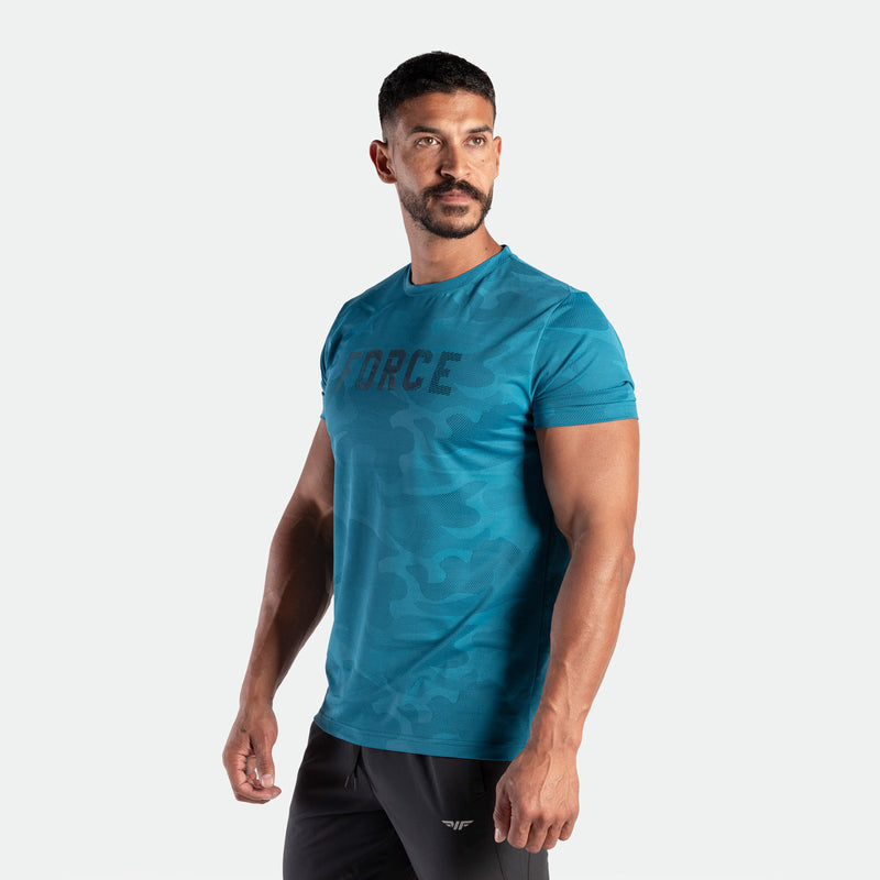 a fit man wearing camo t-shirt  Saxony blue with logo and pants grey with logo 