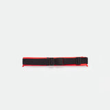 A TOMATO-RED utility belt with an adjustable buckle and two side straps, displayed on a plain white background.