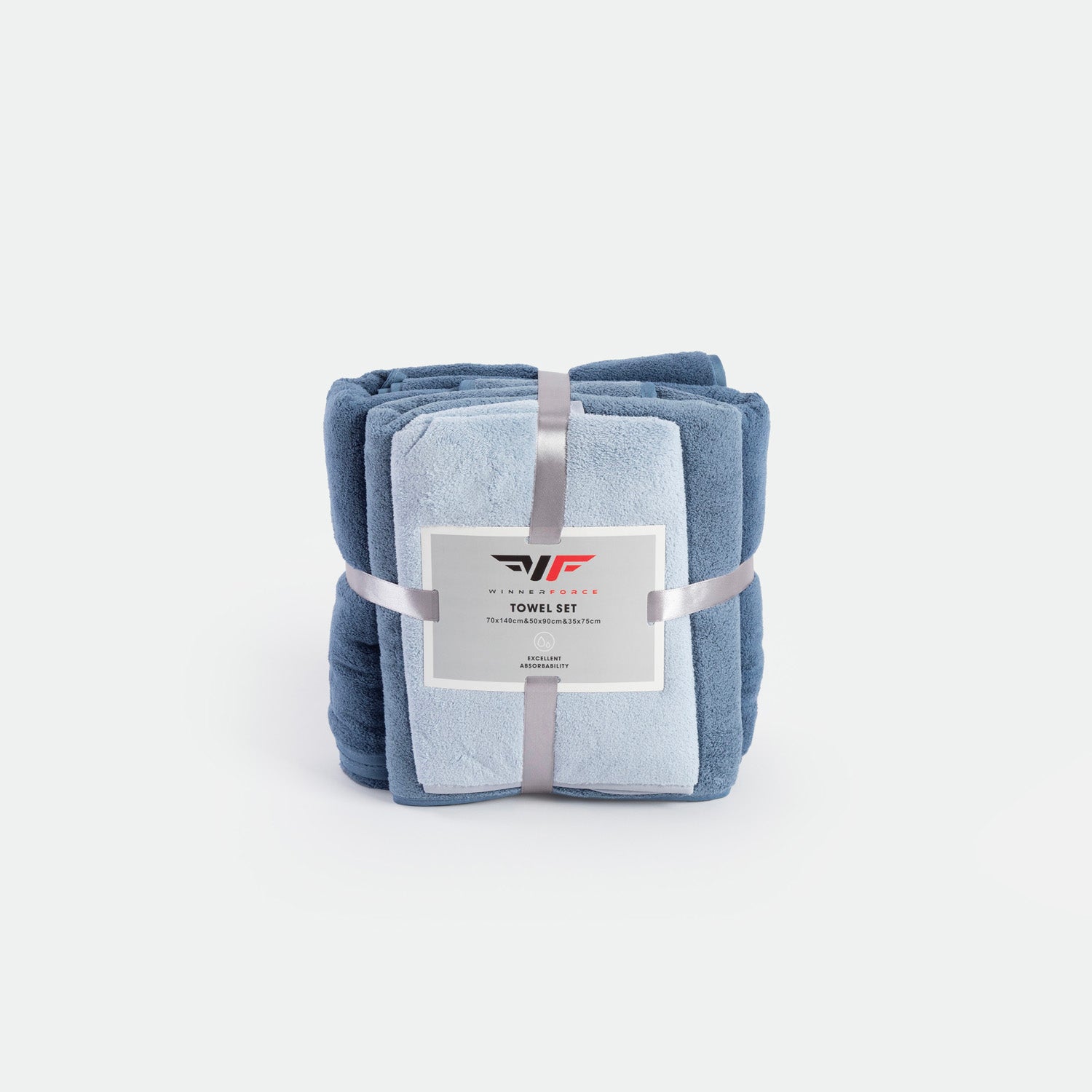 A neatly stacked towel set in shades of blue, tied with a silver ribbon and displaying a label. The image conveys softness and elegance.