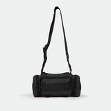 A black duffel bag with multiple zippered compartments and an adjustable shoulder strap