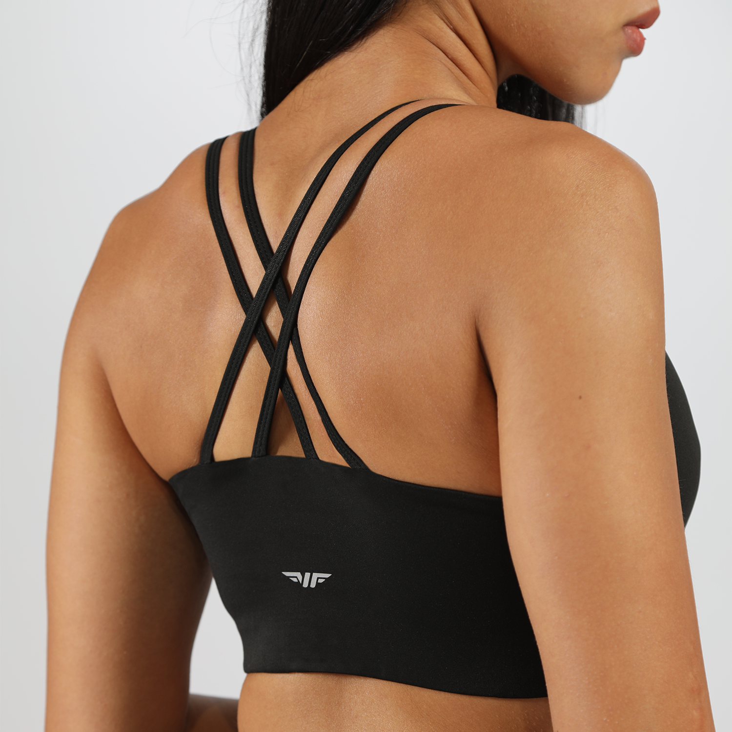 a back view for woman wearing bras ,plus logo