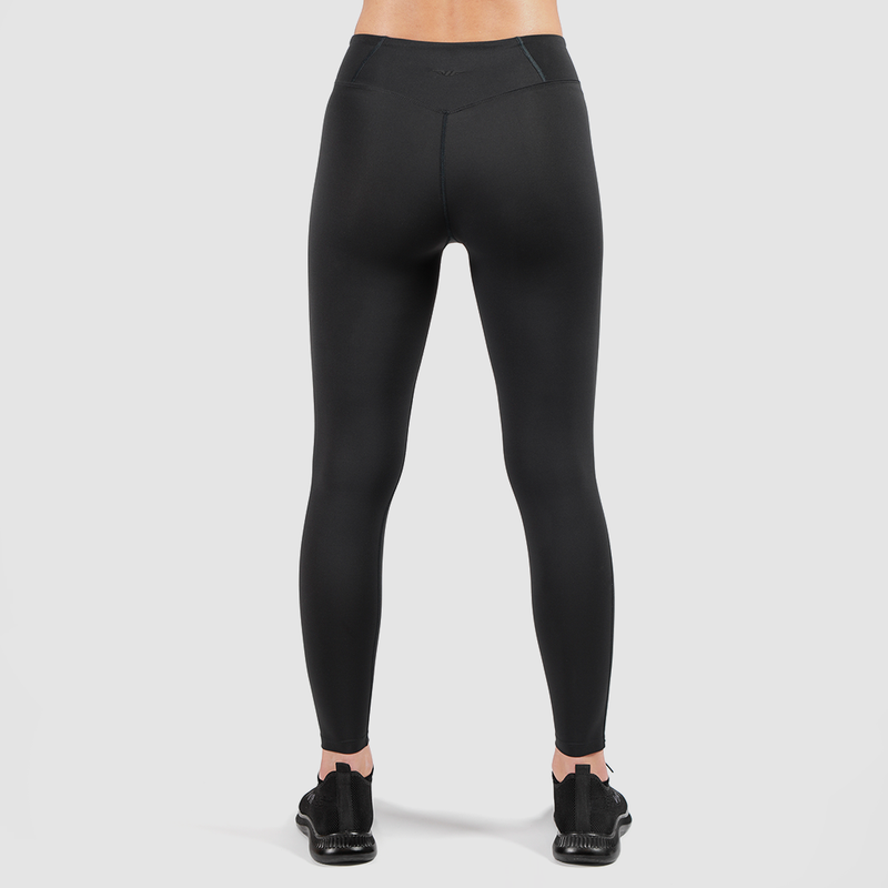 a back view for fit woman wearing legging and shoes black ,the background is light grey 