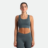 a fit woman wearing  matching set stormy grey  bra and legging 