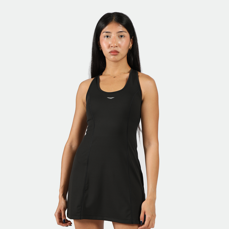 a fit woman stand with confidence and look at the camera ,she wearing dress black with logo 