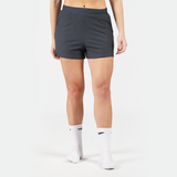 a fit woman wearing short grey with socks white ,plus the background is light grey 